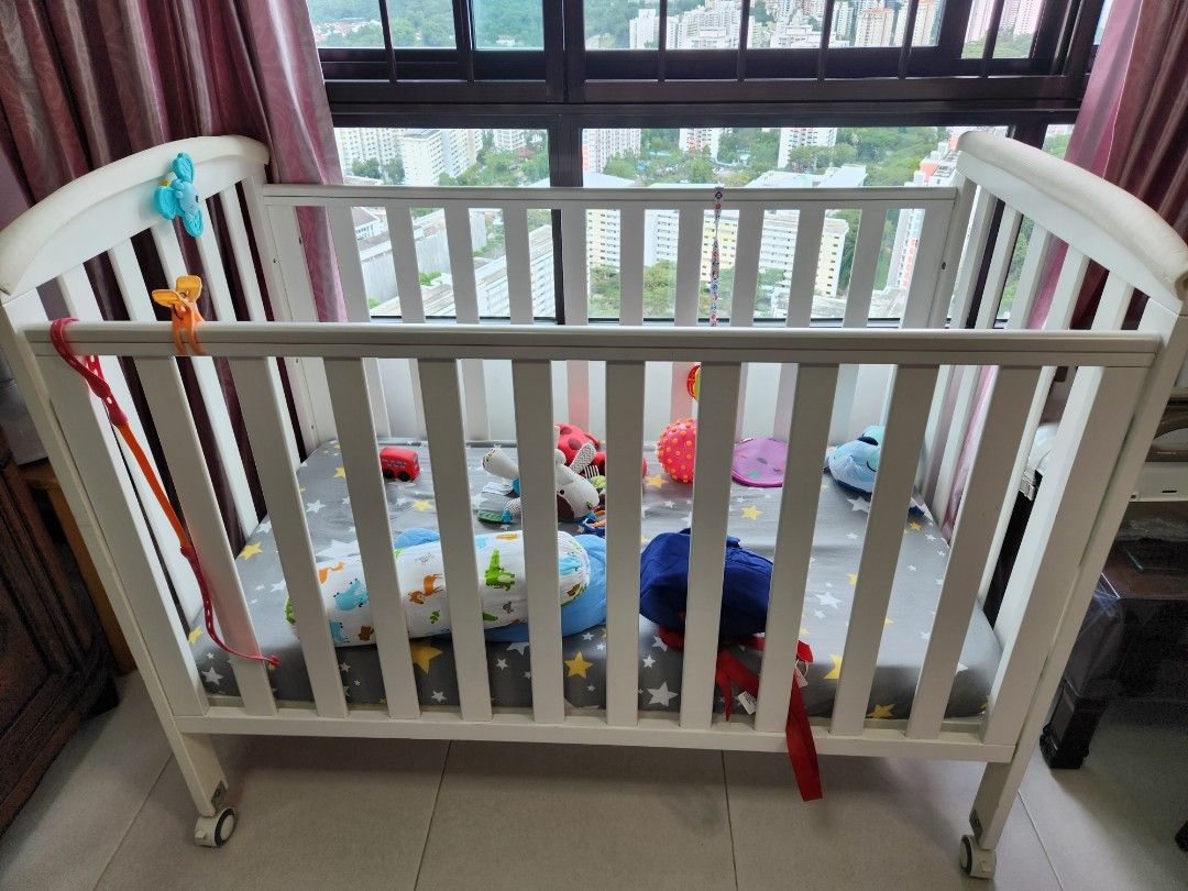 White baby cot with wheels and gate, Babies & Kids, Baby Nursery & Kids