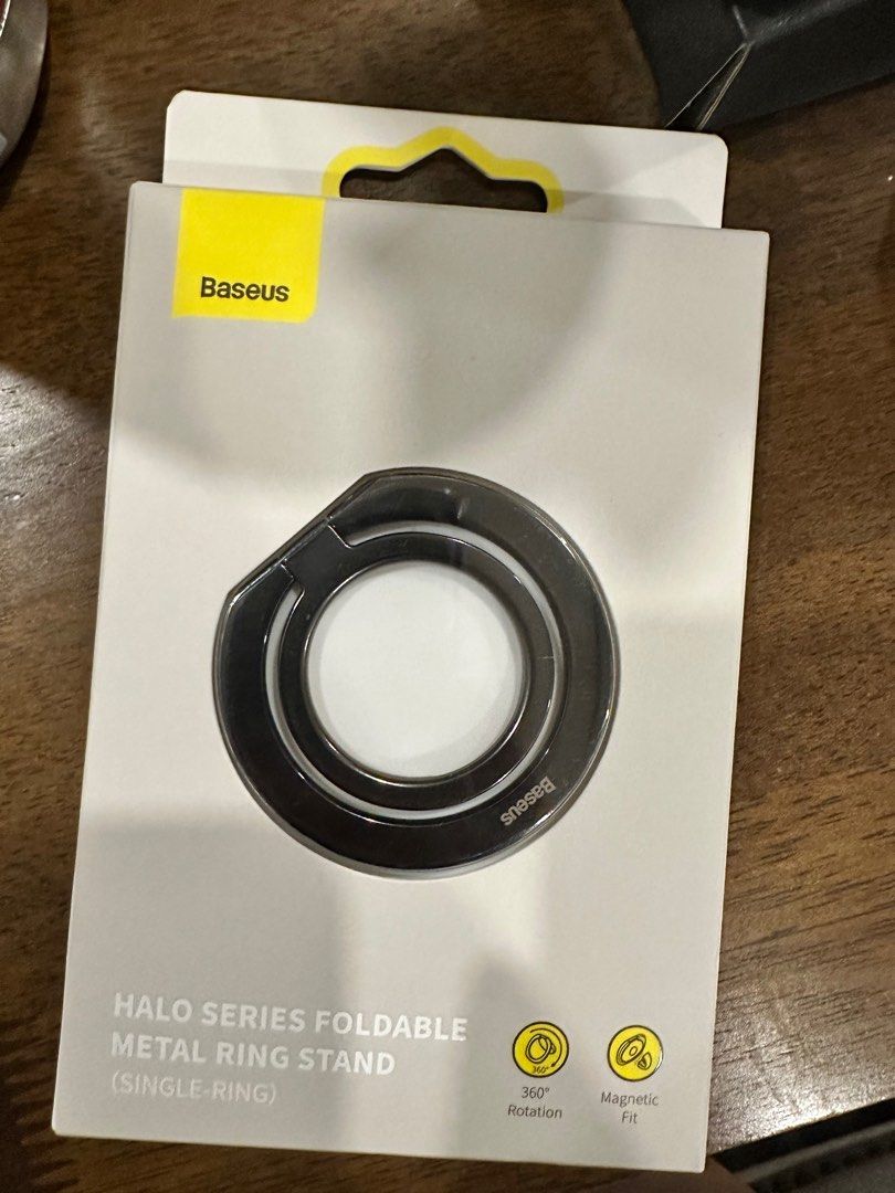 BASEUS: Foldable Metal Ring Stand (Category: Mounts & Holders) located in Manila. Submitted by rmgcloset (Listing ID 1204068103, Image 3). Description: Bought this for 539 pesos. Used for only 1 month with some minor scratches in the item but negligible from afar. No problems with the magnet. Box still intact and with the free magnet sticker for phone with no Magsafe features. RFS: using a new ring mount Buyer will shoulder delivery fee..