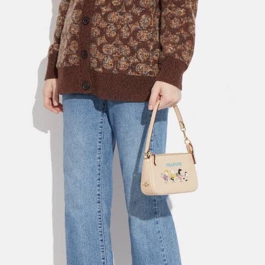 Coach Shoulder Bag (Peanuts) (Category: Luxury Bags & Wallets) located in Manila. Submitted by sl.collections (Listing ID 1204101362, Image 1). Description: With dustbag With paperbag With receipt .