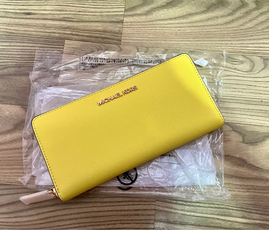 Long bright yellow Michael Kors wallet, Women's Fashion, Bags & Wallets,  Purses & Pouches on Carousell