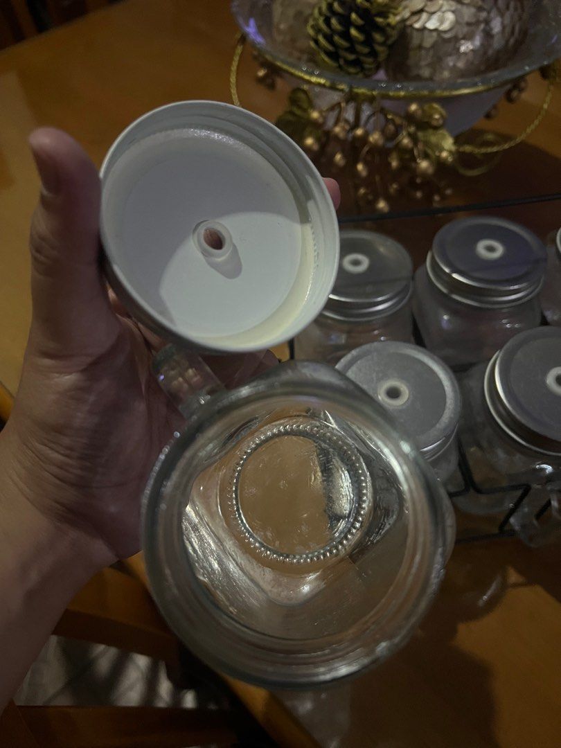 Mason Jar set with Holder (Category: Other Kitchenware & Tableware) located in Pasig City. Submitted by etcyshop (Listing ID 1204158980, Image 3). Description: 6 pcs mason jar with cover come with caddy/ holder Unused, in good condition, no chipping or cracks (except for minor rusting in some of the outside mason jar covers due to storage) Comes in set Perfect for movie night/ outdoor picnics.