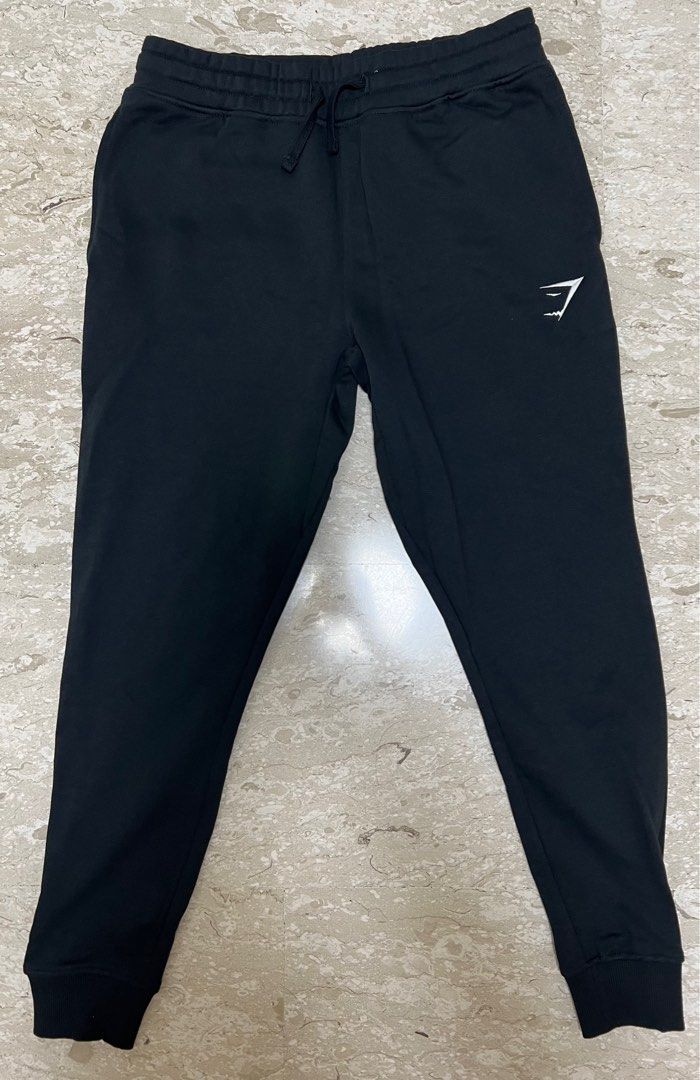 Authentic Gymshark Crest joggers black size M, Men's Fashion, Bottoms,  Joggers on Carousell