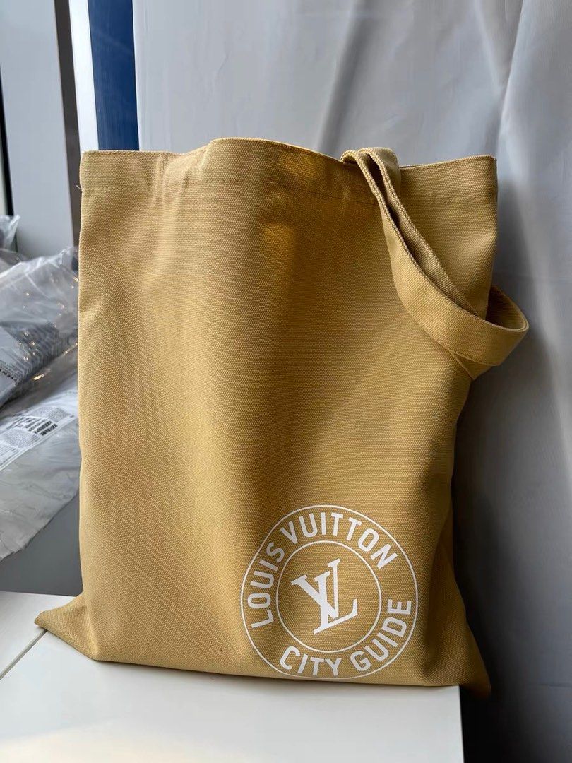Louis Vuitton canvas tote with lv city guide, Luxury, Bags