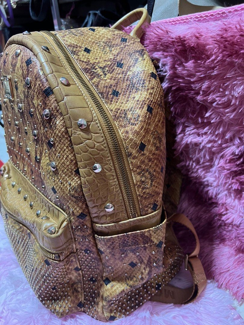 MCM studded backpack in snake skin leather, Luxury, Bags & Wallets on