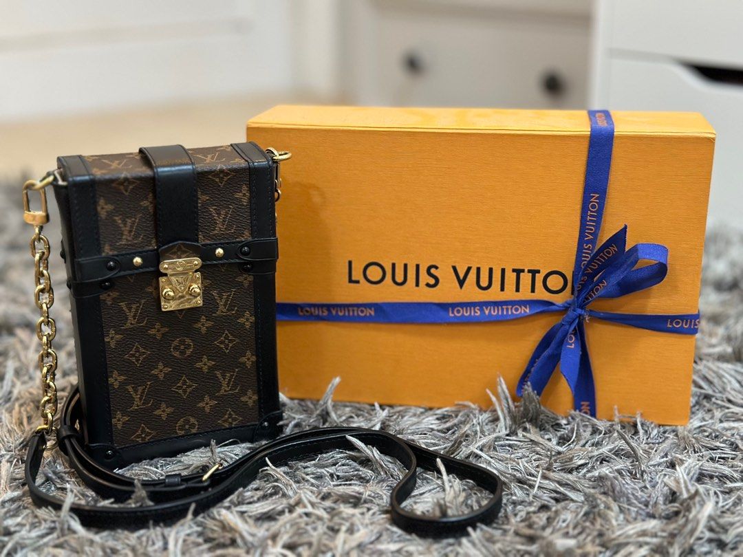 Lv Vertical trunk Pochette, Luxury, Bags & Wallets on Carousell