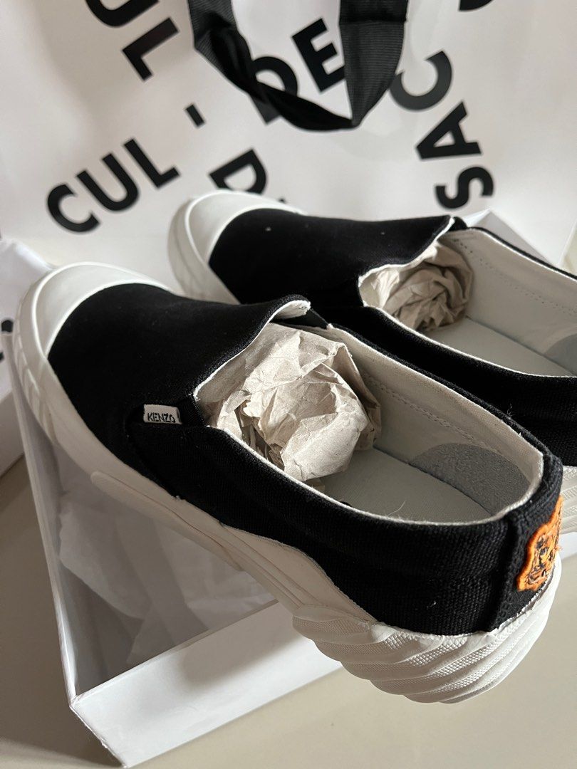 Kenzo tiger crest slip on sneakers (Category: Sneakers) located in Quezon City. Submitted by preloved4ever_ (Listing ID 1204561399, Image 3). Description: Brand new, never used. Rfs: wrong size Bought at cul de sac, podium. Srp: P15,200 Complete box and paperbag.