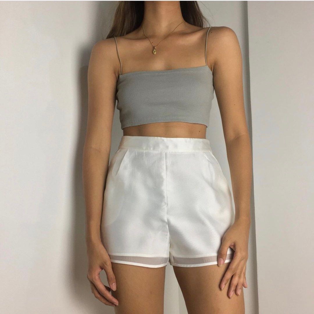 white trouser shorts high waist (Category: Shorts) located in Taguig. Submitted by jdeclutter__ (Listing ID 1204622014, Image 1). Description: waist 28 length 13 flaws: stains (not seen when worn) with pockets, double lined, and zipper on the side.
