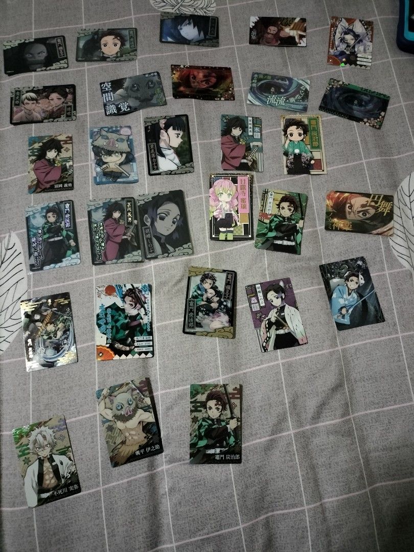 Demon slayer cards set (Category: Raw Singles) located in Caloocan City. Submitted by MovesLikeJeager (Listing ID 1204753235, Image 1). Description: Demon slayer cards set A mix of offiical and unofficial (china cards) metal cards, wafer cards, 3d cards RFS: Change line Pm if interested.