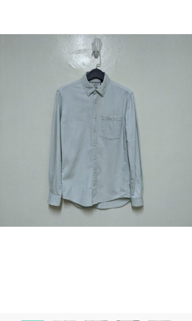 Thomas Pink Light Denim Shirt (Category: Formal Shirts) located in Binan City. Submitted by theformer (Listing ID 1204753470, Image 1). Description: Size on tag: XS (Fits like an S) Measurements: Chest - 19 in Shoulders - 17 in Sleeves - 26.5 in Length - 27.5 in Search: Denim shirt, Button down, Polo, Top, Collar, Long Sleeve.