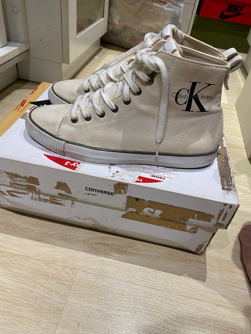 [repriced] Calvin Klein Hi-tops (Category: Sneakers) located in Quezon City. Submitted by Always_Disposing (Listing ID 1204959581, Image 1). Description: Size 9 TTS Missing box Cream upper - white midsole (design is rlly like that) Prolly 7/10 condition due to minor drags and stains 500.