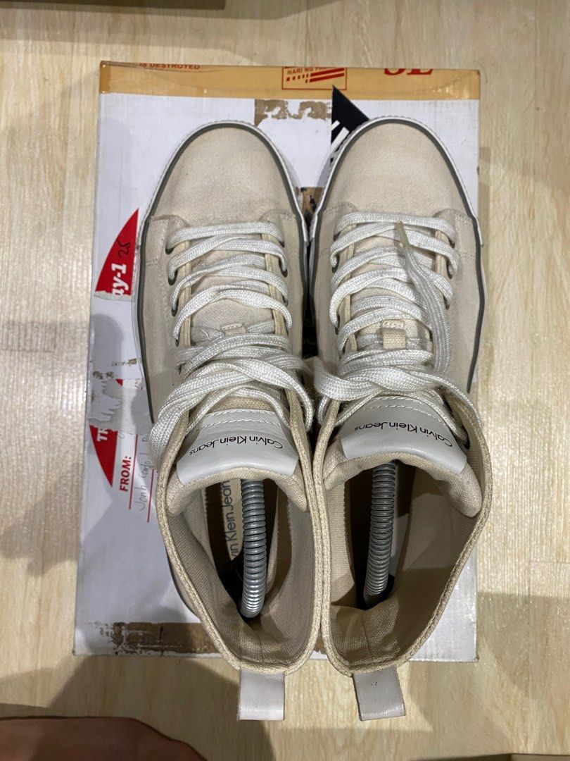 [repriced] Calvin Klein Hi-tops (Category: Sneakers) located in Quezon City. Submitted by Always_Disposing (Listing ID 1204959581, Image 3). Description: Size 9 TTS Missing box Cream upper - white midsole (design is rlly like that) Prolly 7/10 condition due to minor drags and stains 500.