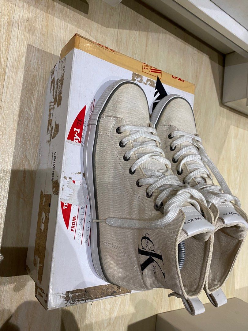 [repriced] Calvin Klein Hi-tops (Category: Sneakers) located in Quezon City. Submitted by Always_Disposing (Listing ID 1204959581, Image 2). Description: Size 9 TTS Missing box Cream upper - white midsole (design is rlly like that) Prolly 7/10 condition due to minor drags and stains 500.