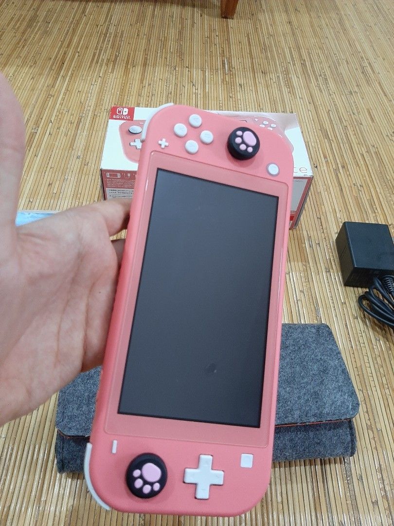 Nintendo switch 2024 lite coral sale