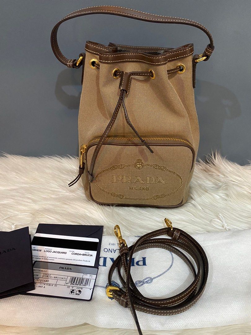 Prada logo jacquard bucket bag beige