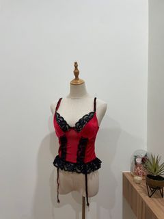 red corset top with black lace details sleeveless
