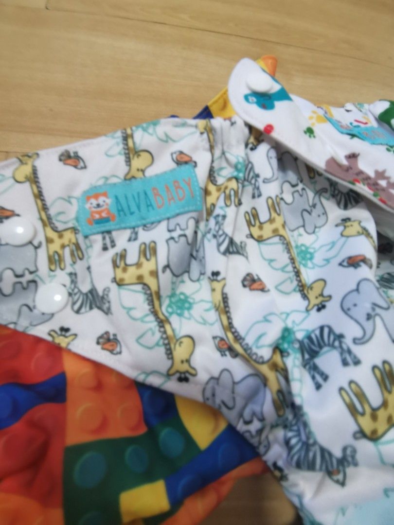 Bundle Cloth diaper with inserts (Category: Diapers & Baby Wipes) located in Bulacan. Submitted by ryzaaaaaa (Listing ID 1205071503, Image 2). Description: PTPA thank you🥰 Preloved Cloth diapers! 4pcs Cover type (cost 430) 7pcs Alva Cloth diaper (cost 1800) With 7pcs 5-Layer Bamboo charcoal inserts 1500 na lang! Barely used. Hindi kinaya mag-cloth diaper🤣 Loc: Bulacan MOP: gcash, bank transfer Courier: Shopee, J&T, LBC.