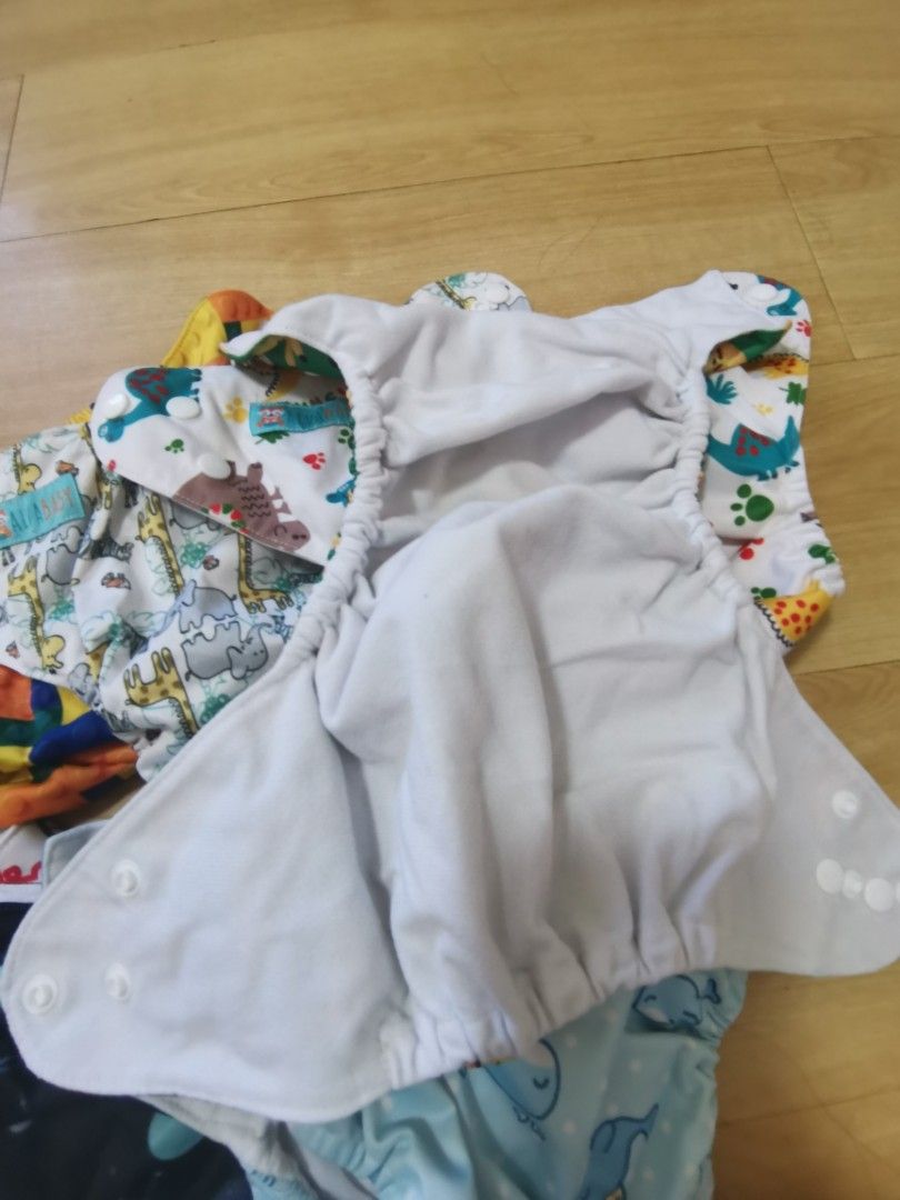 Bundle Cloth diaper with inserts (Category: Diapers & Baby Wipes) located in Bulacan. Submitted by ryzaaaaaa (Listing ID 1205071503, Image 3). Description: PTPA thank you🥰 Preloved Cloth diapers! 4pcs Cover type (cost 430) 7pcs Alva Cloth diaper (cost 1800) With 7pcs 5-Layer Bamboo charcoal inserts 1500 na lang! Barely used. Hindi kinaya mag-cloth diaper🤣 Loc: Bulacan MOP: gcash, bank transfer Courier: Shopee, J&T, LBC.