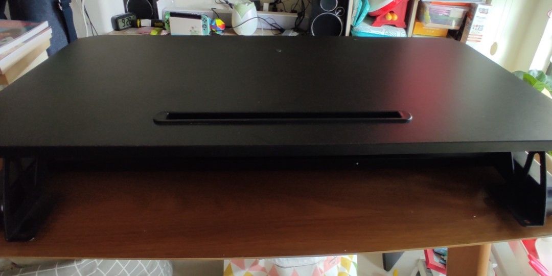 Height adjustable table. (Category: Tables & Sets) located in Singapore. Submitted by lawrencechia (Listing ID 1205139892, Image 1). Description: Small table to place on another table to set monitor on it to use for computer. there is a small keyboard tray. (not installed screws missing) table size 40x80cm..