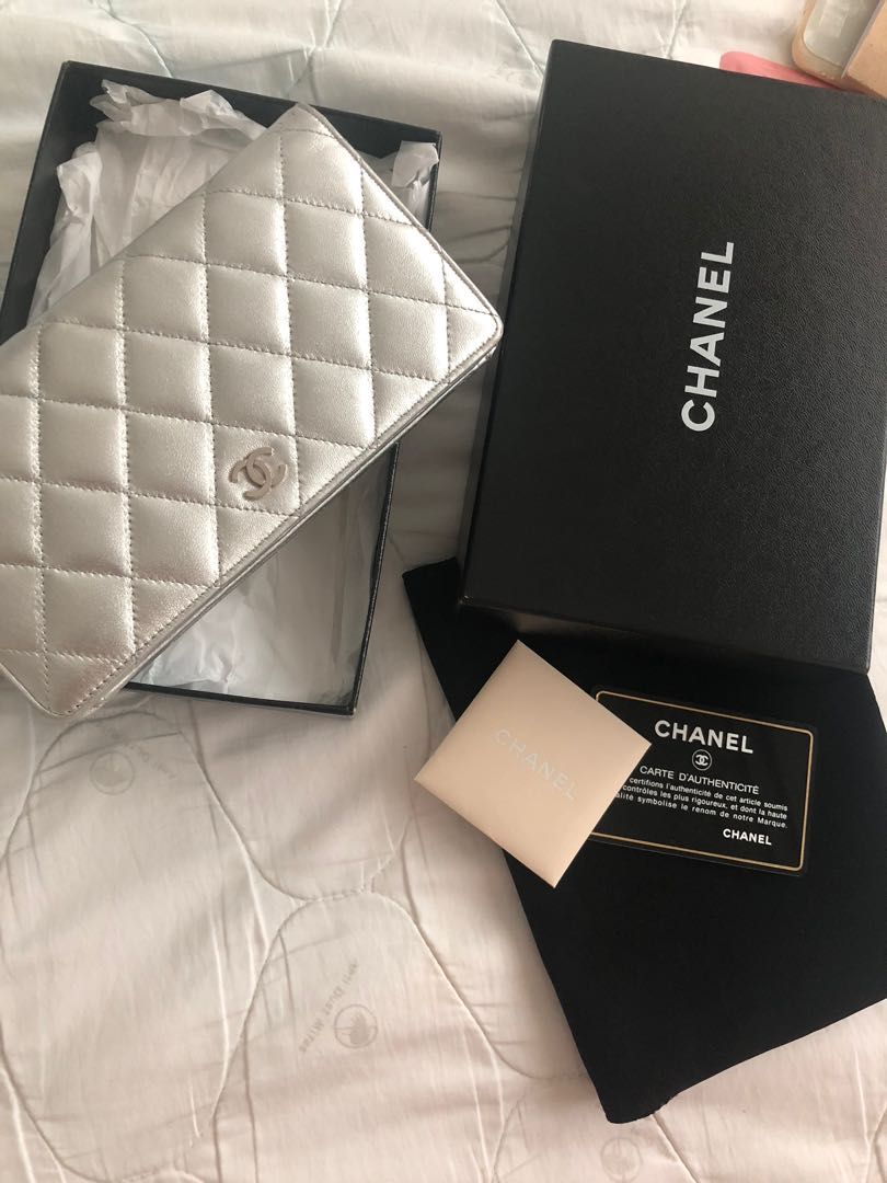 Authentic Chanel Wallet (Category: Bags & Wallets) located in Seremban. Submitted by wafflebites (Listing ID 1205356927, Image 3). Description: Come with box,care card, hologram. Lamb skin in silver colour , 8 card slots , zip available. It’s a very elegant champagne silver colour which i use as a clutch during dinner event . Have been brought for fews years so normal minor scratches on the surface in some part. Not for fussy buyer .Condition 7/1