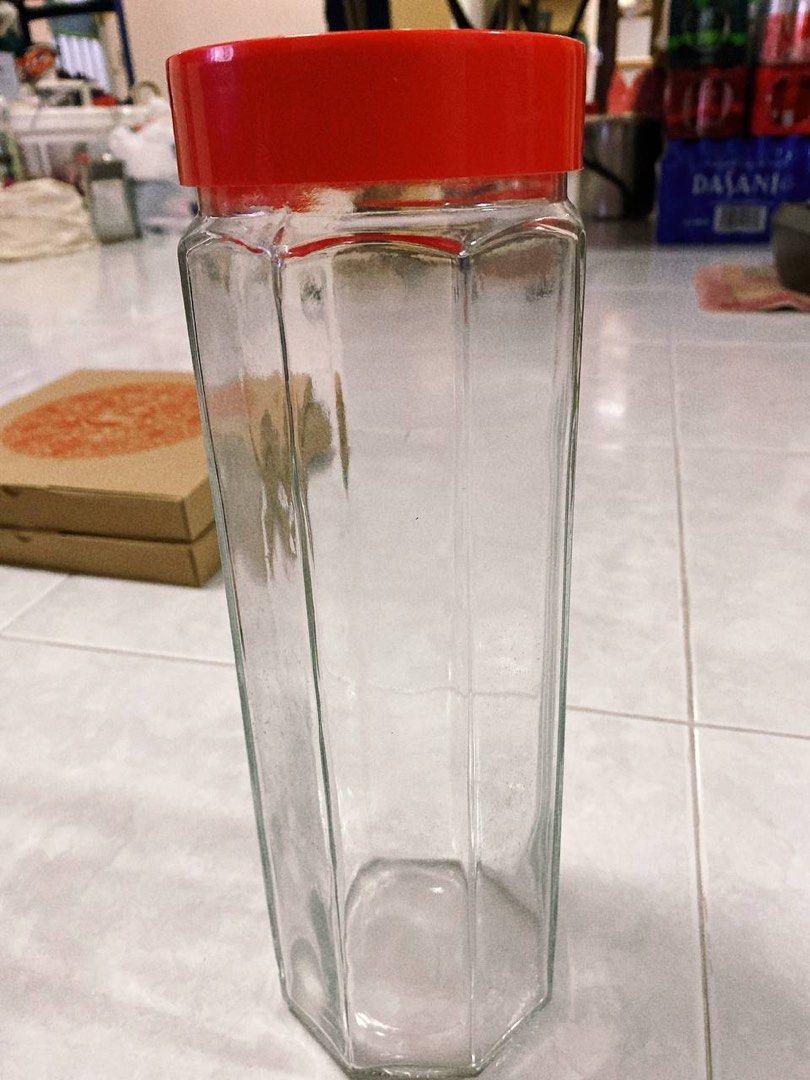 Bottle of kombucha with a glass next to it