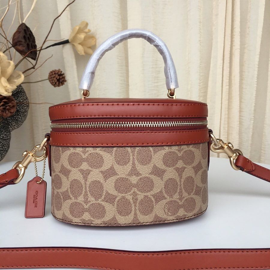 COACH s new classic printing bucket cosmetic bag 31728 women s bag shoulder bag Selena cooperation model Trail bag different styles personality