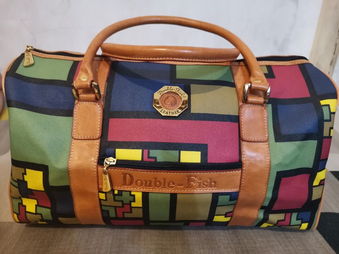 DOUBLE FISH TRAVEL BAG (Category: Luxury Bags & Wallets) located in Quezon City. Submitted by amreensonlinebotique (Listing ID 1205616598, Image 3). Description: ✅💯ORIGINAL DOUBLE FISH ✅WITH ORIGINAL STRAP ✅NO FLAW, SIGNS OF USE ONLY ✅ELEGANT TRAVEL BAG.