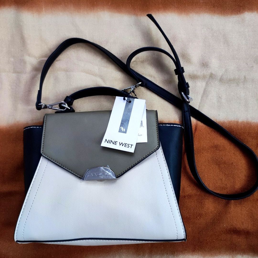 Nine West Flap Over Cross-body (Category: Cross-body Bags) located in Silang. Submitted by marinellabianca (Listing ID 1205490789, Image 2). Description: This effortlessly chic crossbody bag is an accessory that you'll be using for seasons to come. - Textured, durable synthetic upper - Flap over construct with magnetic closure - Secure inner zipper pocket and slip-in slot - Single grab top handle - Detachable and adjustable shoulder strap.