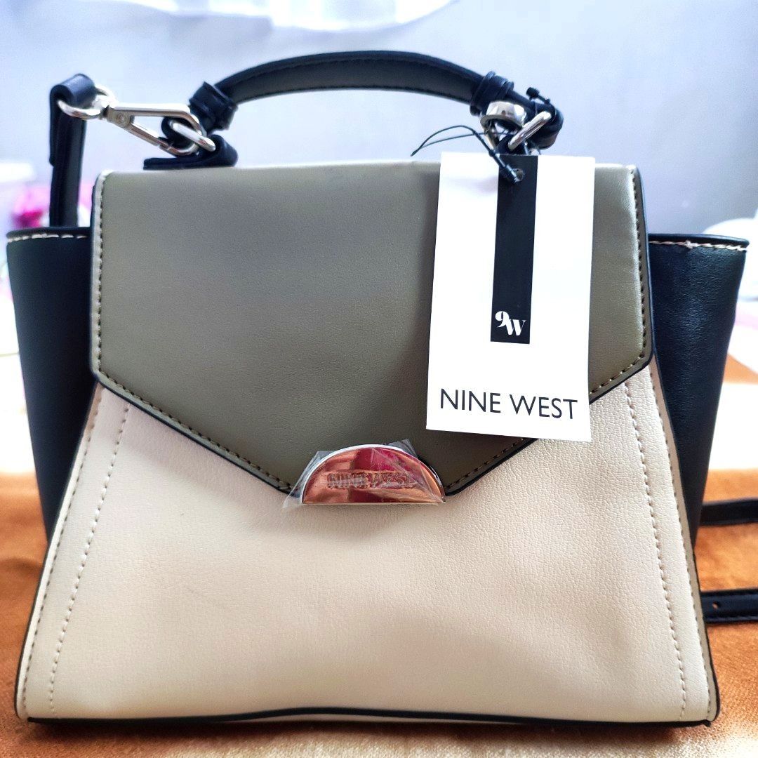Nine West Flap Over Cross-body (Category: Cross-body Bags) located in Silang. Submitted by marinellabianca (Listing ID 1205490789, Image 1). Description: This effortlessly chic crossbody bag is an accessory that you'll be using for seasons to come. - Textured, durable synthetic upper - Flap over construct with magnetic closure - Secure inner zipper pocket and slip-in slot - Single grab top handle - Detachable and adjustable shoulder strap.