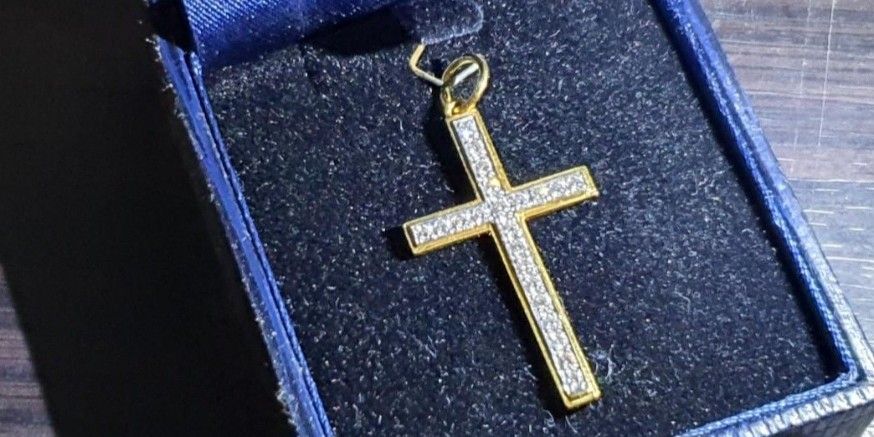 Gold and diamond crucifix 2024 necklace