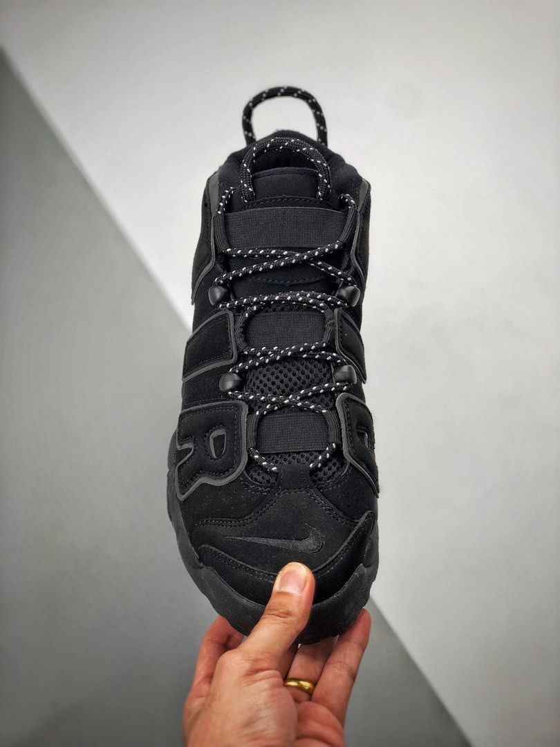 Nike uptempo black top reflective on feet