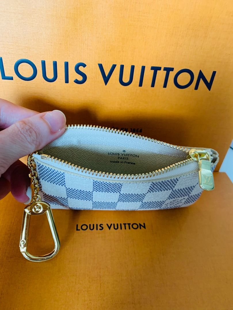 Discover Louis Vuitton Key Pouch: <BR>This practical pouch holds