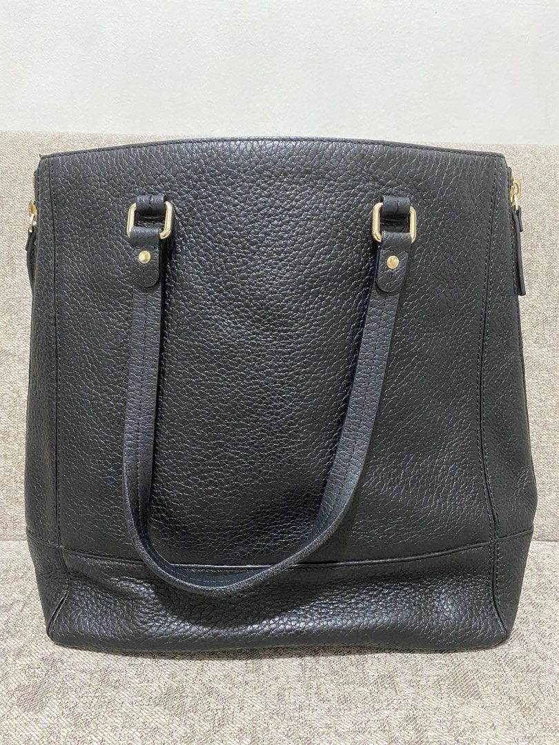 Kate Spade big leather tote bag (Category: Luxury Bags & Wallets) located in Quezon City. Submitted by katparcs (Listing ID 1206242503, Image 2). Description: Authentic money back guranteed if proven fake Kate Spade tote bag. Big bag good for office use. Can fit laptop. Size 13 inches length, 6 inches width and 14 inches height. Some scuffings on the straps and base but barely noticeable. and ink marks inside. RFS decluttering..