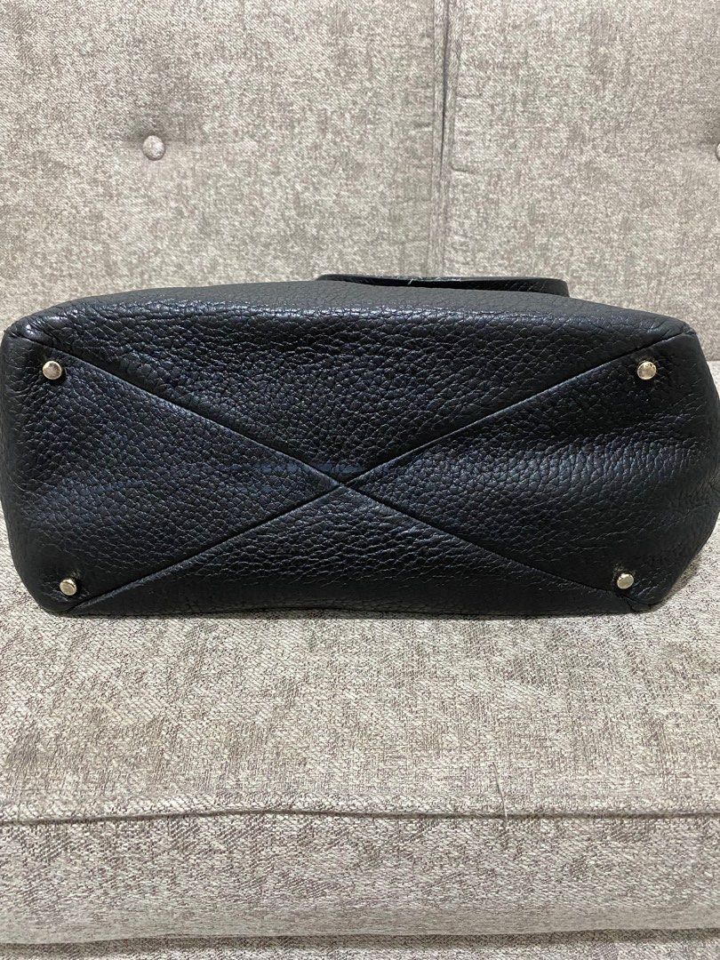 Kate Spade big leather tote bag (Category: Luxury Bags & Wallets) located in Quezon City. Submitted by katparcs (Listing ID 1206242503, Image 3). Description: Authentic money back guranteed if proven fake Kate Spade tote bag. Big bag good for office use. Can fit laptop. Size 13 inches length, 6 inches width and 14 inches height. Some scuffings on the straps and base but barely noticeable. and ink marks inside. RFS decluttering..