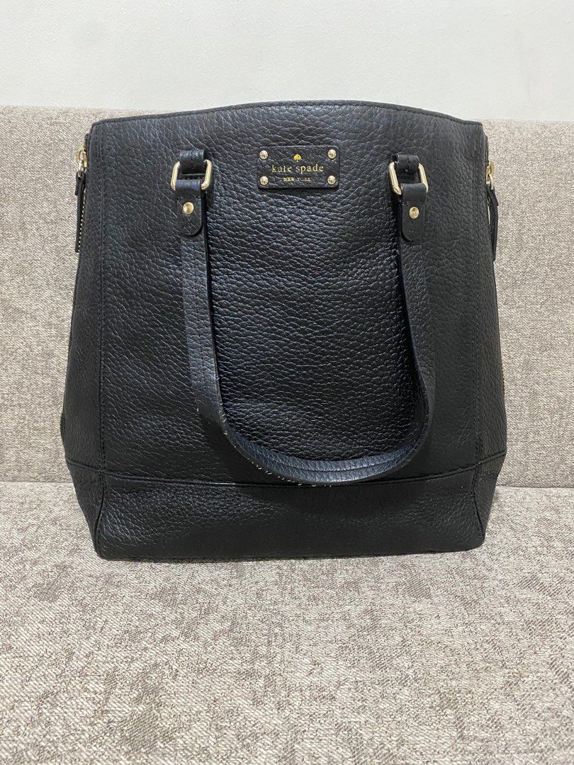 Kate Spade big leather tote bag (Category: Luxury Bags & Wallets) located in Quezon City. Submitted by katparcs (Listing ID 1206242503, Image 1). Description: Authentic money back guranteed if proven fake Kate Spade tote bag. Big bag good for office use. Can fit laptop. Size 13 inches length, 6 inches width and 14 inches height. Some scuffings on the straps and base but barely noticeable. and ink marks inside. RFS decluttering..