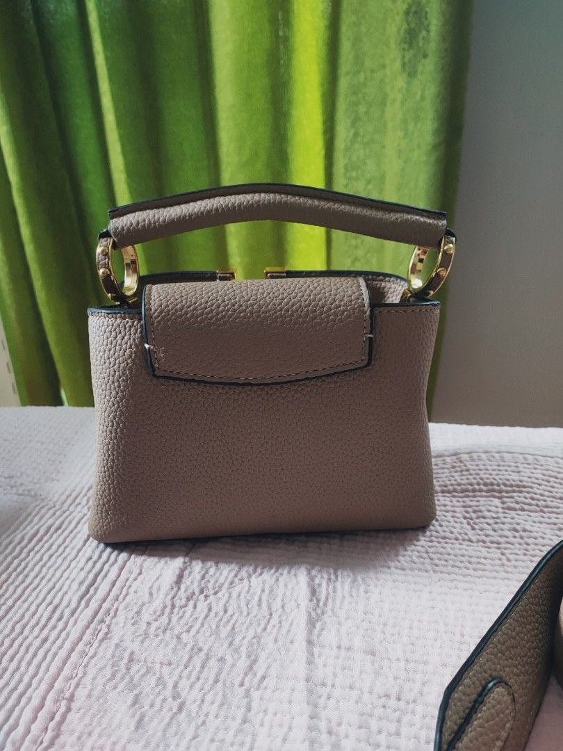 Preloved Lv capucines sling (Category: Luxury Bags & Wallets) located in Cebu City. Submitted by day.98 (Listing ID 1206256385, Image 3). Description: selected from japan surplus genuine leather coded with dust bag no flaws.