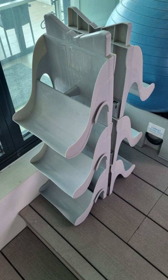 Shoe rack (Stackable) (Category: Outdoor Furniture) located in Singapore. Submitted by duskingang (Listing ID 1206104152, Image 1). Description: A pair of stackable shoe racks for both outdoor and indoor use. Holds up to 6 pairs of shoes. Material: Parkesine $12 each Feel free to text me for any queries Measurements: 21.5cm width by 67cm height by 21cm depth.