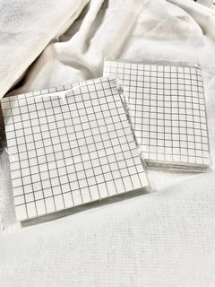 Sticky notes on white with grid