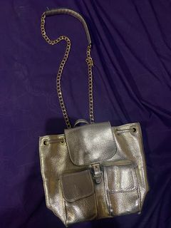 Stradivarius gold mini slingbag