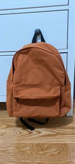 uniqlo backpack in colour orange-used like new
