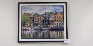 Amsterdam puzzle art display framed with glass and wood