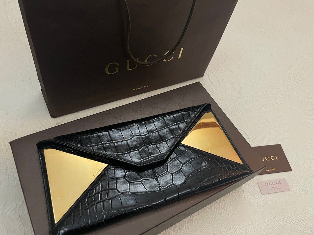 Authentic GUCCI exotic crocodile envelope clutch (Category: Luxury Bags & Wallets) located in Bacolod City. Submitted by houseoflouvre (Listing ID 1200700688, Image 2). Description: AUTHENTIC GUCCI EXOTIC CROCODILE Envelope Clutch In black and gold Comes complete with Box, Paper bag, dustbag, cards Tissue for box .