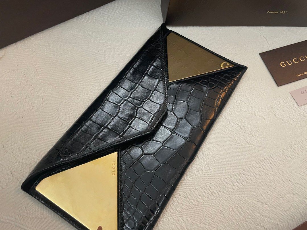 Authentic GUCCI exotic crocodile envelope clutch (Category: Luxury Bags & Wallets) located in Bacolod City. Submitted by houseoflouvre (Listing ID 1200700688, Image 3). Description: AUTHENTIC GUCCI EXOTIC CROCODILE Envelope Clutch In black and gold Comes complete with Box, Paper bag, dustbag, cards Tissue for box .