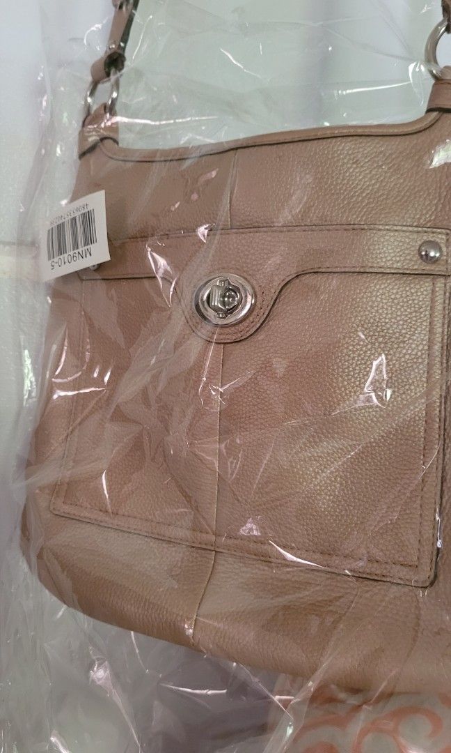 Coach crossbody bag nude beige (Category: Luxury Bags & Wallets) located in Batangas. Submitted by flying_cosmos (Listing ID 1200602101, Image 2). Description: not used, almost brand new as seen on pics from US, authentic no flaws 10.5 x 11.5 inches.