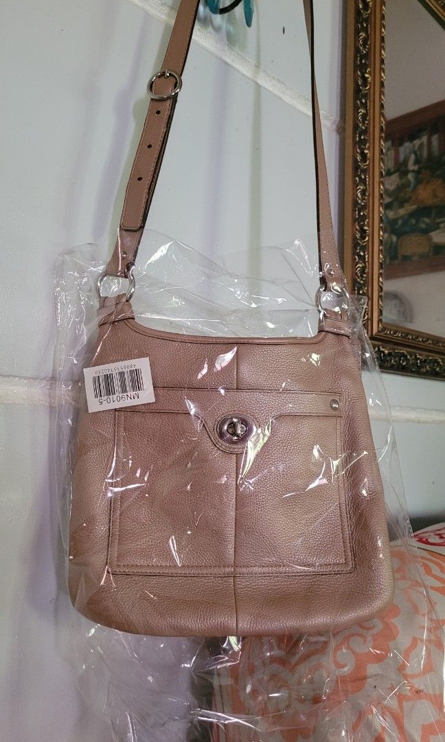 Coach crossbody bag nude beige (Category: Luxury Bags & Wallets) located in Batangas. Submitted by flying_cosmos (Listing ID 1200602101, Image 1). Description: not used, almost brand new as seen on pics from US, authentic no flaws 10.5 x 11.5 inches.