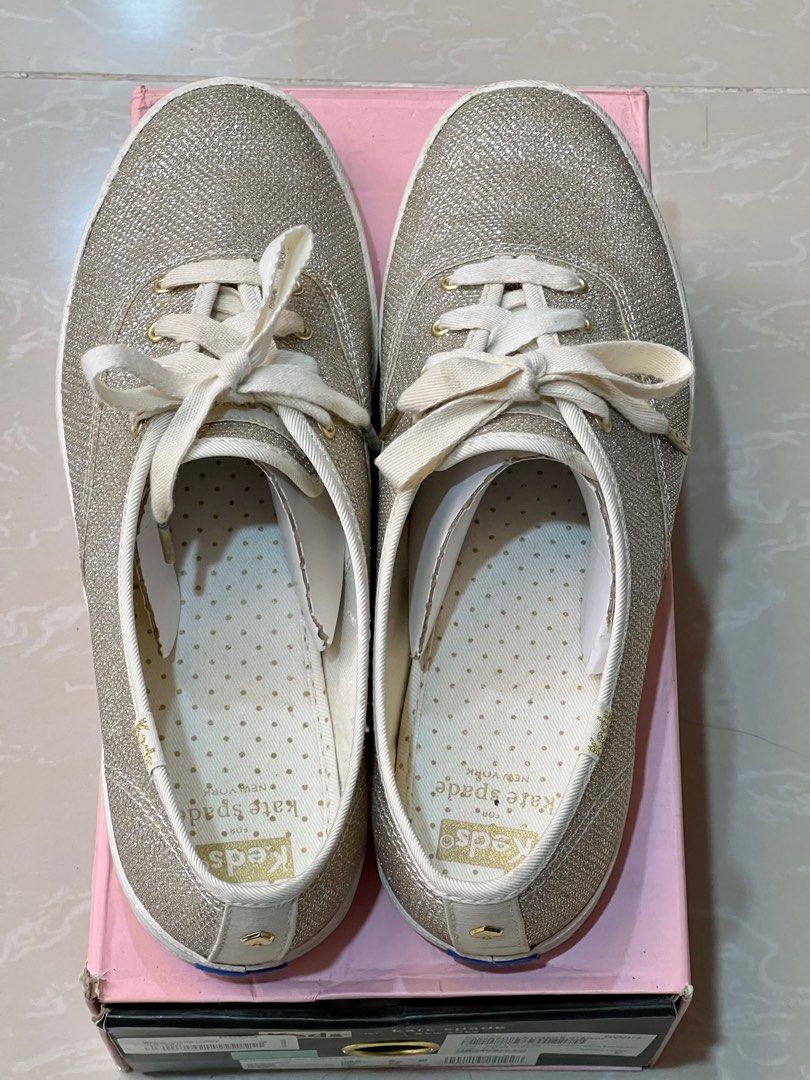 Keds x Kate Spade Sneakers (Category: Sneakers) located in Paranaque City. Submitted by joyzann (Listing ID 1206382094, Image 2). Description: Keds x Kate Spade Sneakers Light Gold US Size 9 With unused shoelace/ribbon as shown in pic Retails for 4995 in the Laz Official Store A bit bigger for my size Super pretty in actual Slightly nego .