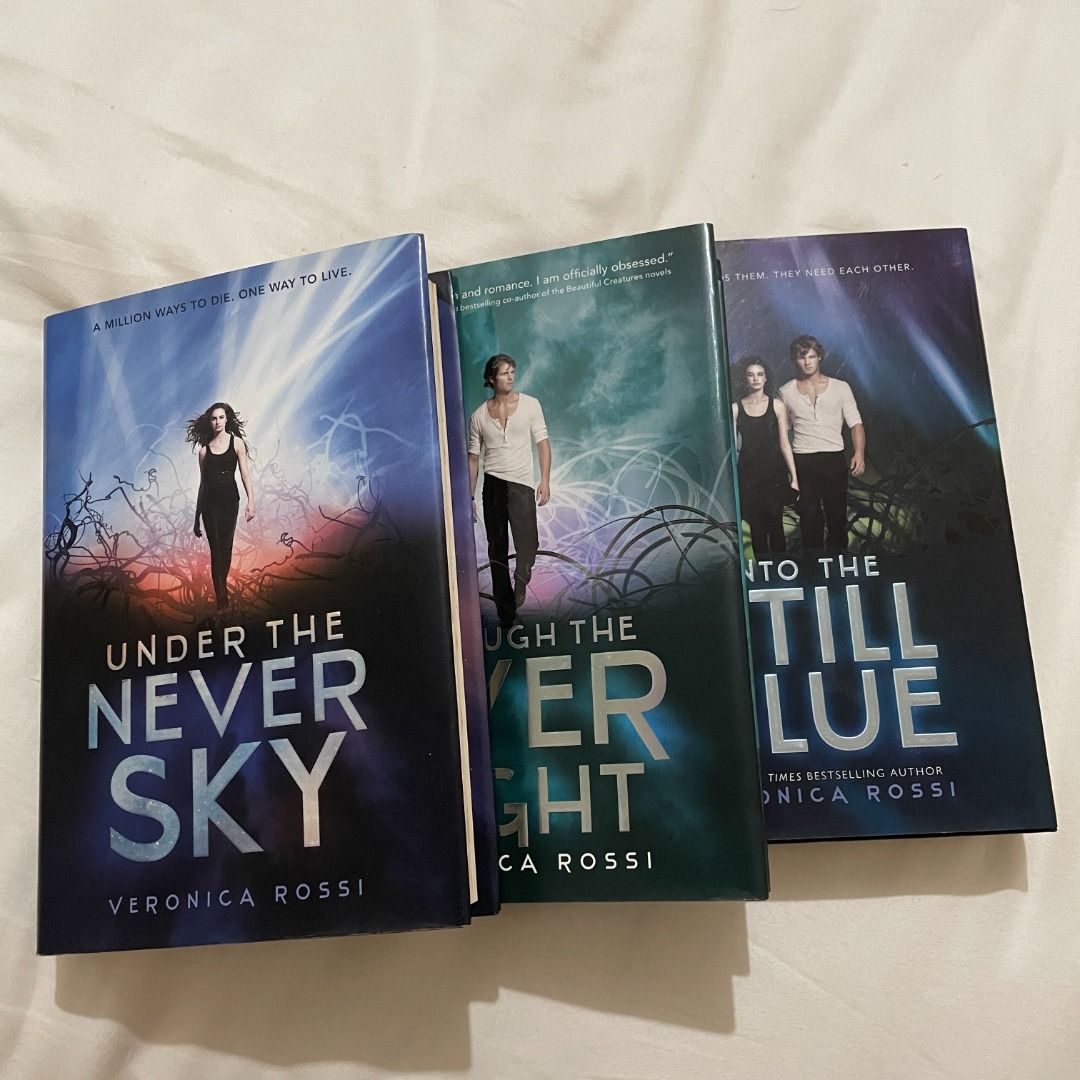 *SIGNED* Under the Never Sky Trilogy by Veronica Rossi (Category: Storybooks) located in Taguig. Submitted by celinedomore (Listing ID 1206498648, Image 1). Description: Under the Never Sky by Veronica Rossi Through the Ever Night by Veronica Rossi Into the Still Blue by Veronica Rossi Signed and personalized to "Celine" Good Condition, Has signs of aging Price: PHP 1500 MOP: GCash, BPI, UnionBank MOD: Lalamove, Grab, LBC (Buyer will shoulder shi