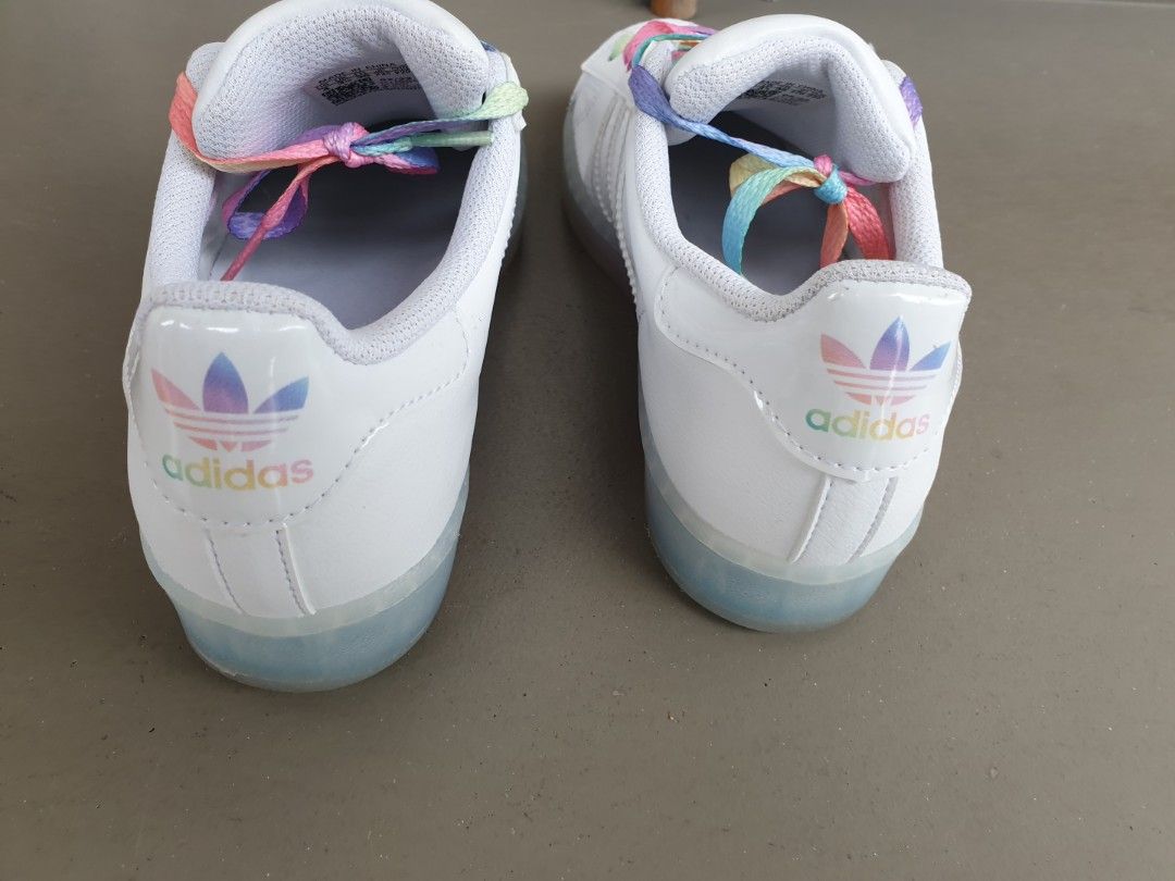 White adidas shoes hotsell with rainbow stripes