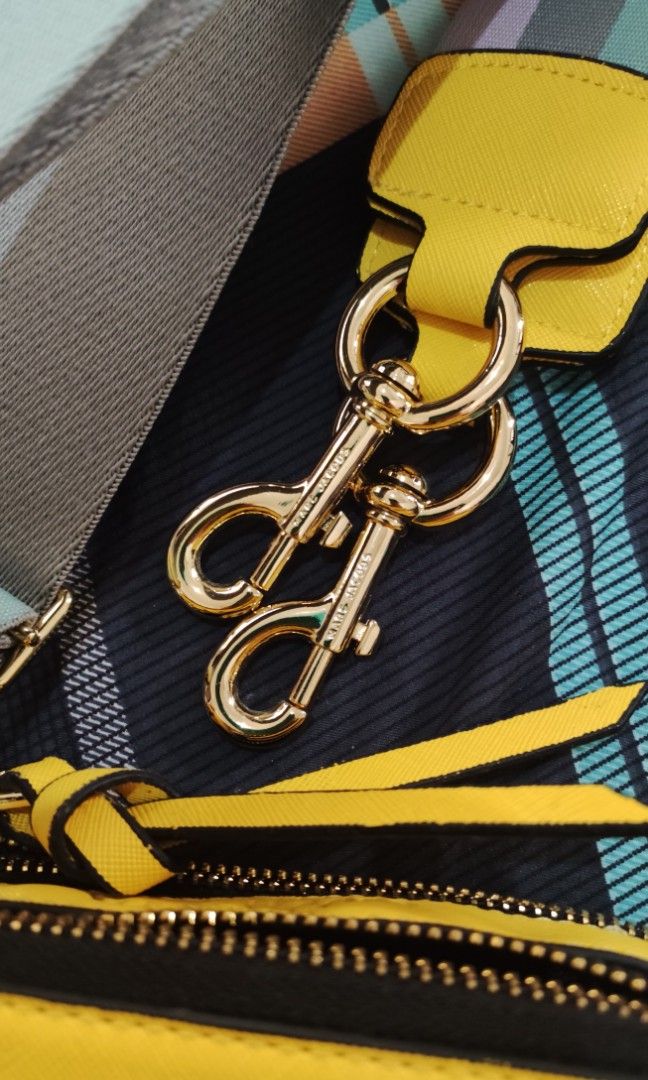 Marc Jacobs Snapshot Camera Bag (Category: Luxury Bags & Wallets) located in Paranaque City. Submitted by happy_tanny (Listing ID 1206584584, Image 2). Description: Marc Jacobs Snapshot camera bag, color yellow, with gold hardware, card, dustbag and wide pastel colored strap. NOT OG.