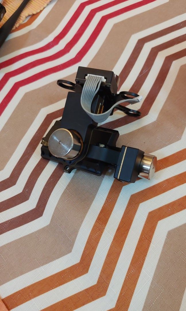 Dji phantom 2 parts (Category: Drones) located in Manila. Submitted by anything.that.flies (Listing ID 1200827958, Image 3). Description: gimbal with tear on flex cable going to hero 3 or 4. dji btu bluetooth for those who need parts. be posting other stuff also. thanks.