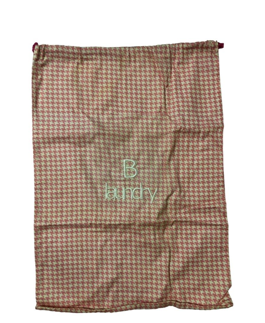 Houndstooth Laundry Bag (Category: Laundry Baskets) located in Makati City. Submitted by aljacinto (Listing ID 1200952030, Image 1). Description: Personalized Laundry Bag Type: Mini Personalized Laundry Bag with letter “B” Color: Pink and White Size: Mini Rank: 10/10. Good condition. It needs to be ironed only. Great for gifts 🥰 #hellosun ☀️.